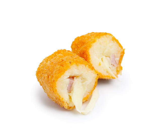istock Delicious fried croquette with cheese and ham isolated on white 2247097452