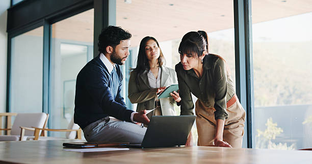 istock Laptop, meeting and project management with business people in office for plan development. Collaboration, computer and tablet with corporate employee team in workplace boardroom for discussion 2247097755