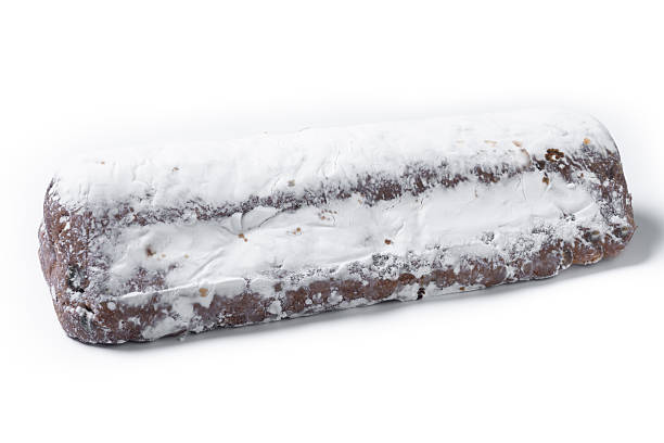 Traditional Christmas Stollen with Raisins and Powdered Sugar isolated on white background