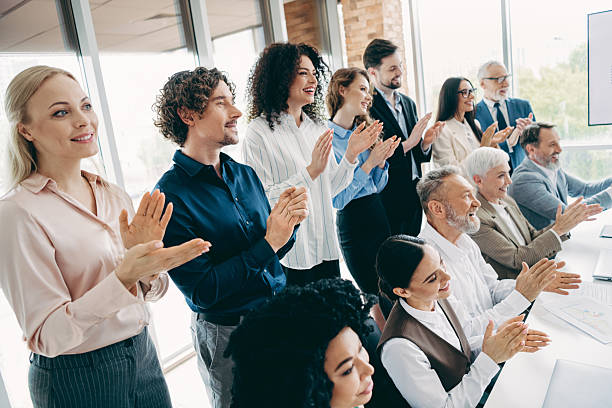 istock Diverse group of professionals celebrating teamwork and achievements in a modern office environment 2247099852