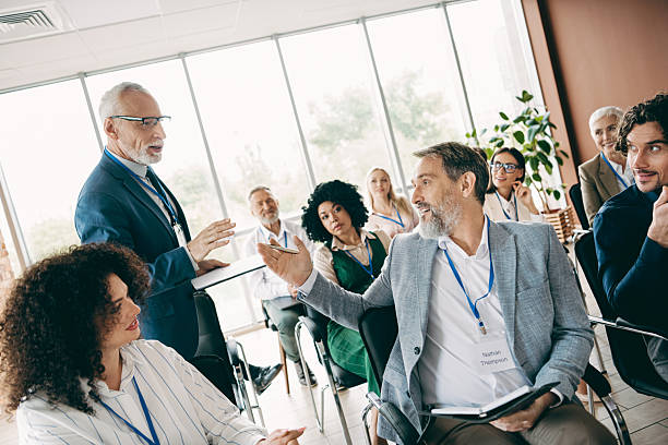istock Professional team discusses business strategies in a conference setting, showcasing collaboration and teamwork. 2247100206