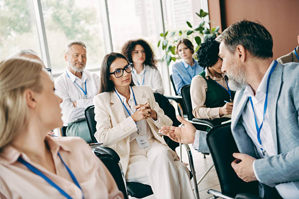 istock Group of diverse professionals in a meeting environment discussing ideas and collaborating in teamwork at an office space 2247100224