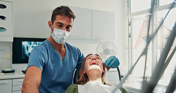 istock Mouth, cleaning and dentist with tools, dental care and checking for cavity, teeth and consultation. Oral hygiene, appointment and examination to prevent tooth decay, patient and woman with toothache 2247102082
