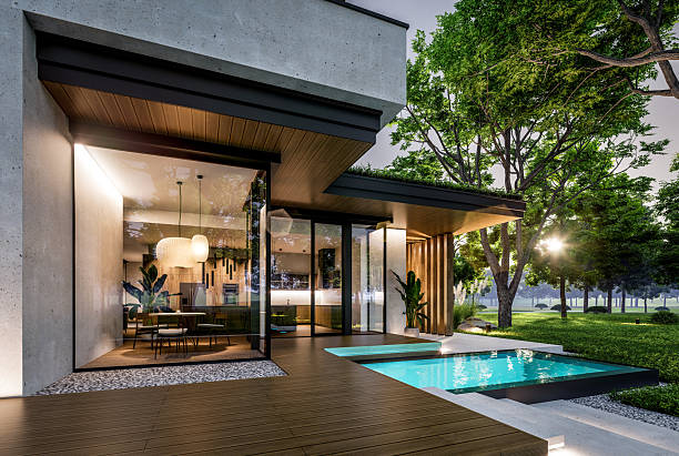 istock 3d rendering of two-story house with concrete facade in evening 2247109933