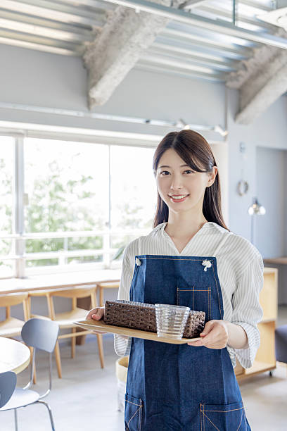 Asian woman working in a cafe