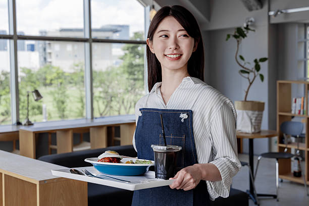 istock Asian woman working in a cafe 2247111645