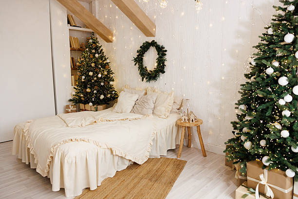 istock Cozy Christmas Bedroom Interior with Festive Lights and Decorated Tree 2247111847