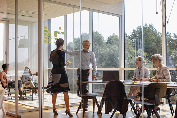 istock Professional Business Executives Engaging in Collaborative Brainstorming in Modern Office 2247112675
