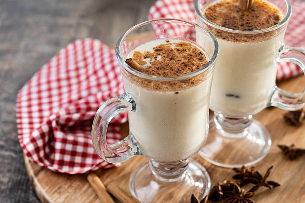 istock Eggnog with Cinnamon and Christmas Decorations 2247112898