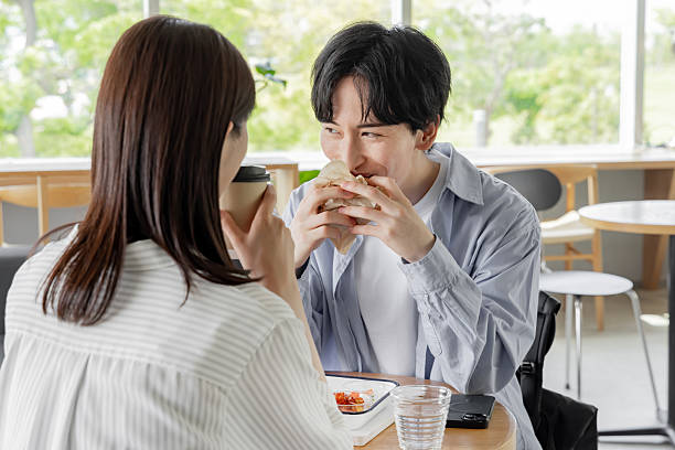 istock Asian couple enjoying lunch at a cafe 2247113303