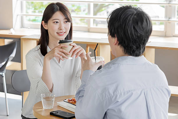 istock Asian couple enjoying lunch at a cafe 2247113361