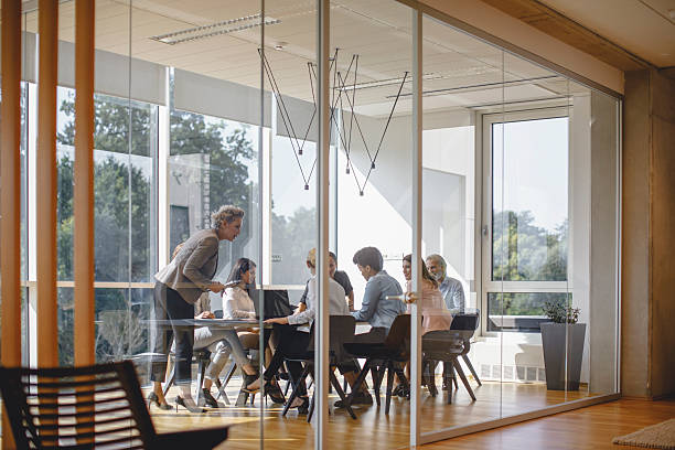 istock Collaborative Business Executives Engaging in Productive Meeting at Stylish Office 2247113425