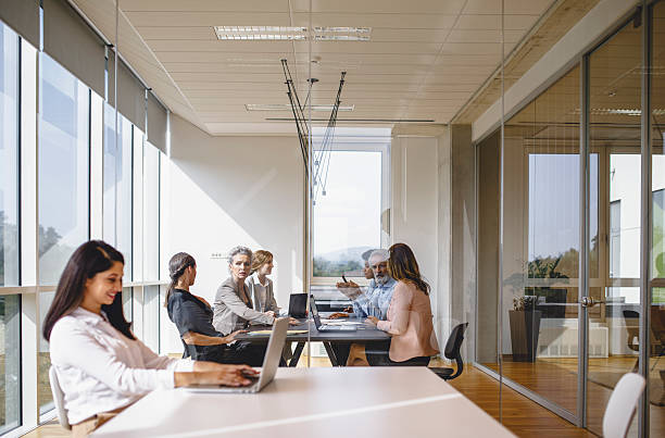 istock Diverse Group of Executives Engaging in Productive Meeting at Stylish Office Table 2247113431