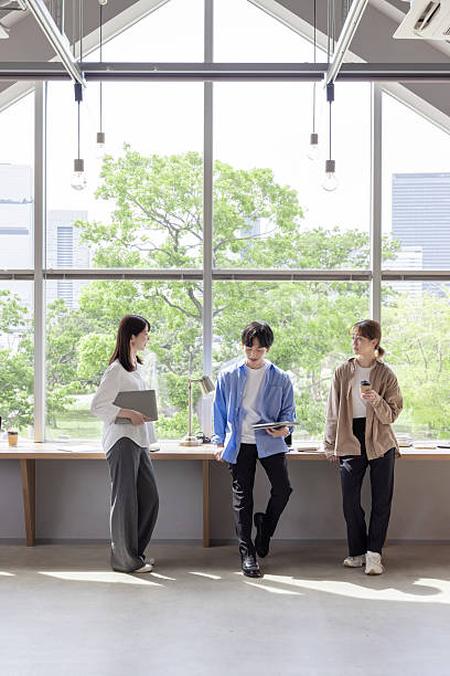 Group of Asian people working in coworking space