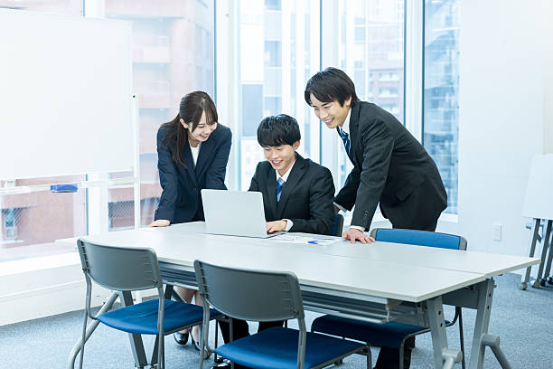 istock young businessmen having a meeting 2247114672