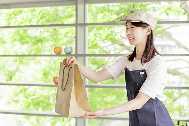 istock Asian woman working in a cafe 2247115641