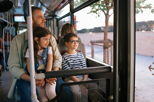 istock Single father with kids exploring a Spanish city by bus 2247115656