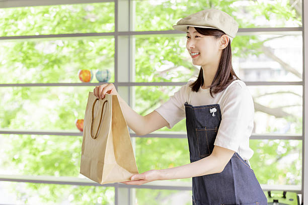 istock Asian woman working in a cafe 2247115663