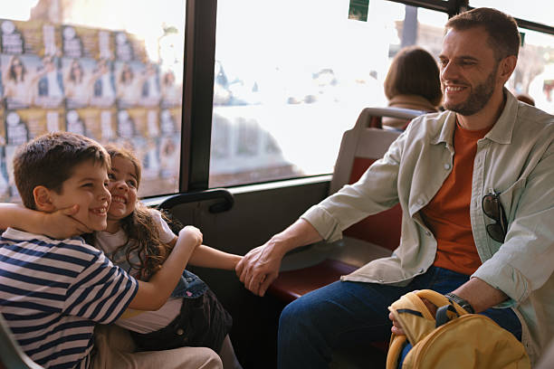 istock Single father with kids exploring a Spanish city by bus 2247115719