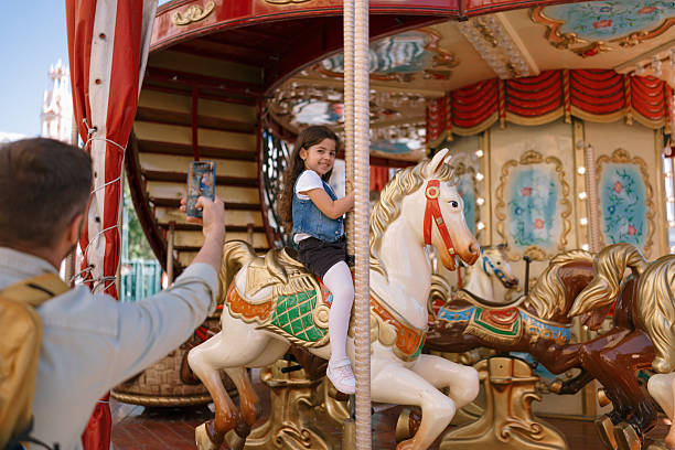 Defocused background of old vintage carousel at in amusement park. Intentionally blurred post production for bokeh effect