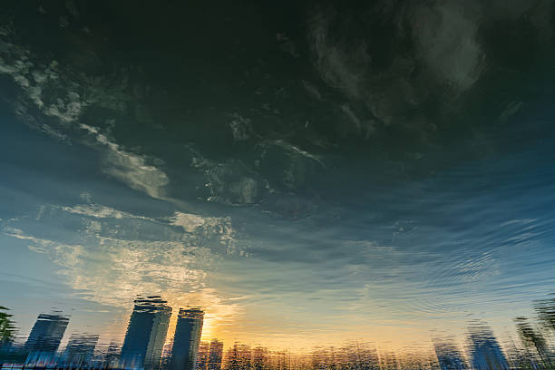 The city skyline reflected on the water at dusk