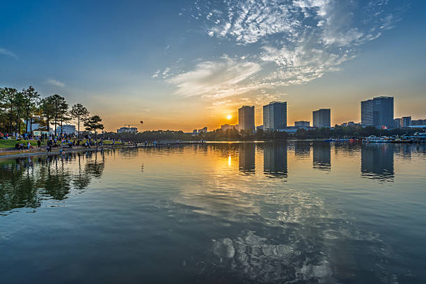 istock Sunset scenery by the city lake 2247117089