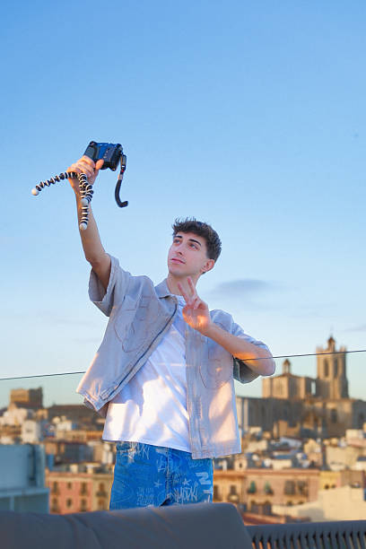 Content Creator Recording Video on City Rooftop with Scenic Tarragona Views