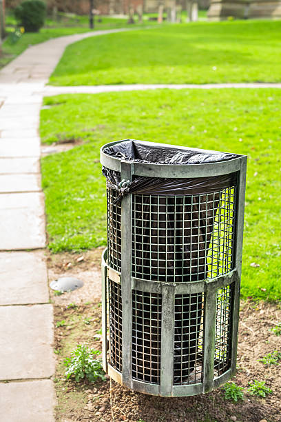 istock Garbage bin in public park, on a sunny day in England 2247121449