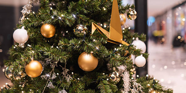 istock Holiday tree branches decorated with golden and white ornaments 2247124727