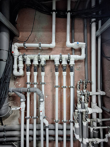 istock The distribution section of the heating and water supply system in a building. White plastic pipes and faucets are present. Background. 2247124976