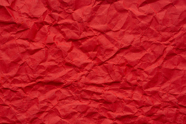 istock Macro crumpled red paper texture,Abstract bold red paper texture background. Texture of crumpled craft paper. Paper background. Recycled red paper backdrop in close up. Dark blood red Textures. Wallpaper. 2247125003