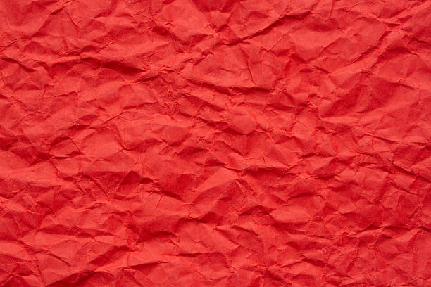 istock Macro crumpled red paper texture,Abstract bold red paper texture background. Texture of crumpled craft paper. Paper background. Recycled red paper backdrop in close up. Dark blood red Textures. Wallpaper. 2247125025
