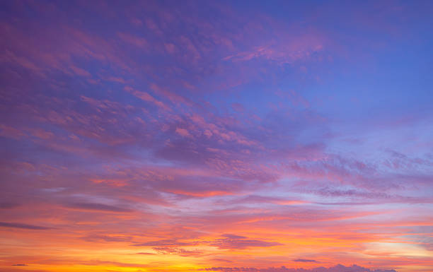 istock Clouds and sky backdrop at sunset and sunrise,Sunset Sky Clouds in the evening with Red, Orange, Yellow and purple sunlight on Golden hour after sundown, Romantic sky in summer on Dusk Twilight 2247125070