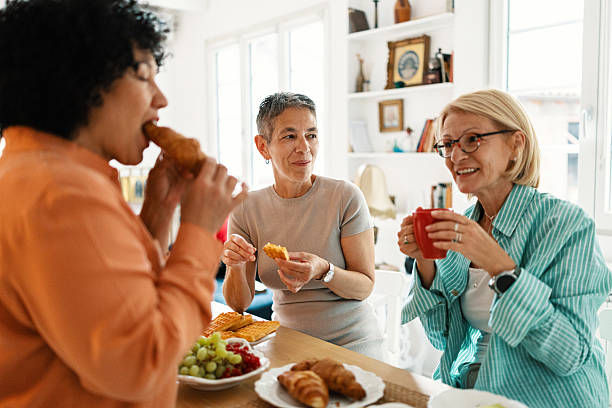 istock Happy mature woman chatting over brunch 2247125317