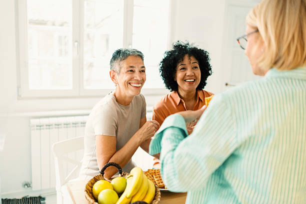 istock Three Women Enjoying Fresh Fruit and Gossiping 2247125376