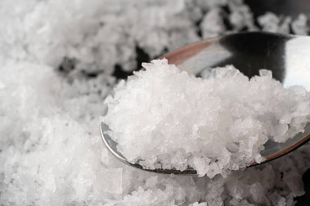 istock Close-up of coarse salt on a spoon 2247128706