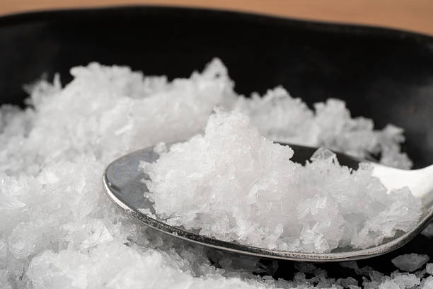 istock Close-up of coarse salt on a spoon 2247128731