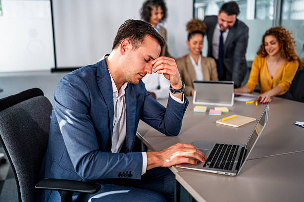 istock Businessman feeling stress and burnout during office meeting 2247128781