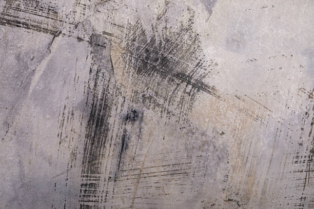 istock Close-up of distressed concrete wall with dark brush 2247130379