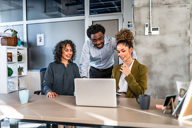 istock Diverse business team collaborating on laptop in office 2247130721