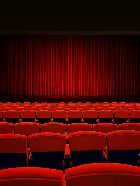 istock Red curtains on a theater stage with red seats. 2247130781