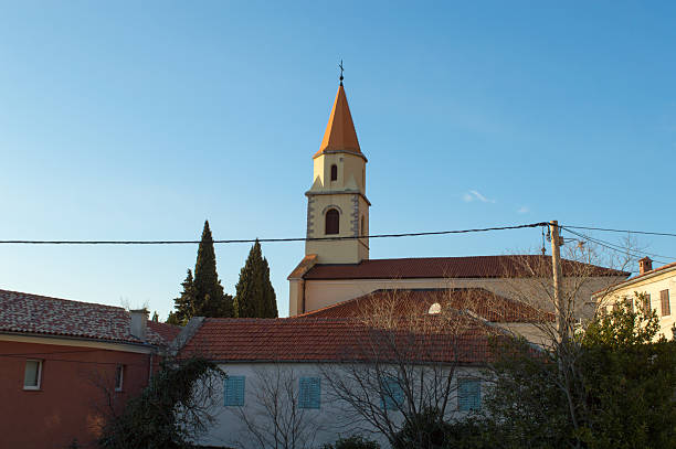Church of St Martin, bell tower and buildings in Grizane, Croatia