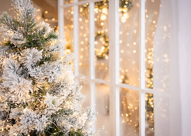istock a decorated Christmas tree with white snowflakes and lights 2247133536