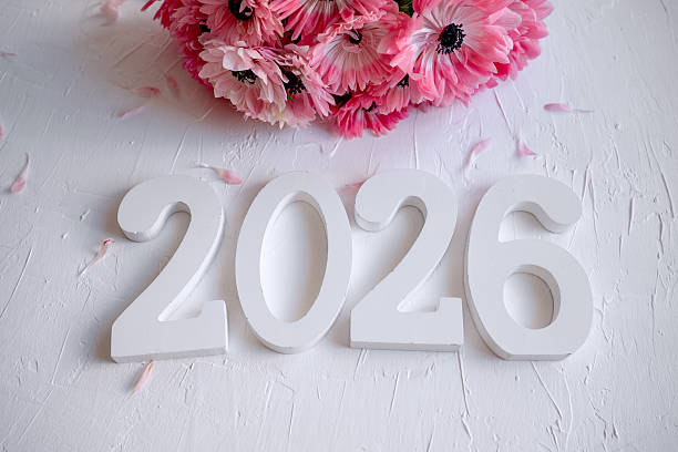 istock White 2026 numbers with pink anemone flowers 2247135332