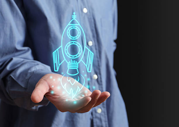 istock Business holding glowing rocket representing startup growth and innovation 2247139622