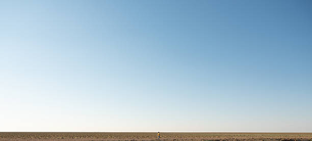 A woman enjoying solitude on the wasteland