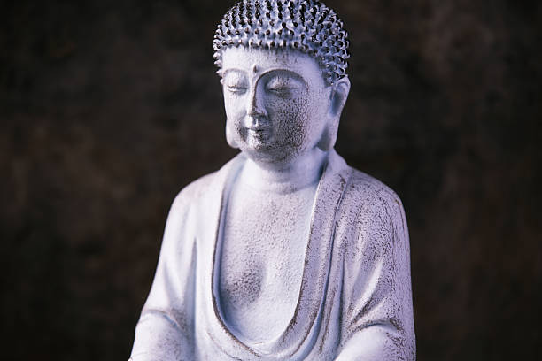 istock Meditating Buddha Statue on dark background. Soft focus. Close up. Copy space. 2247142477