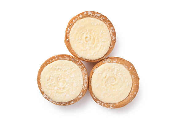 Studio shot of Mince pies with a brandy buttercream topping cut out against a white background