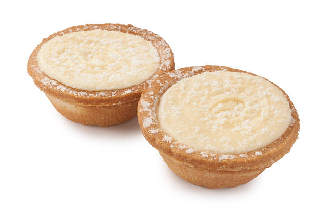 Studio shot of Mince pies with a brandy buttercream topping cut out against a white background