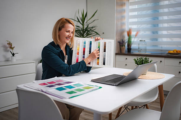 istock Woman making video call showing color swatches for design work 2247143131